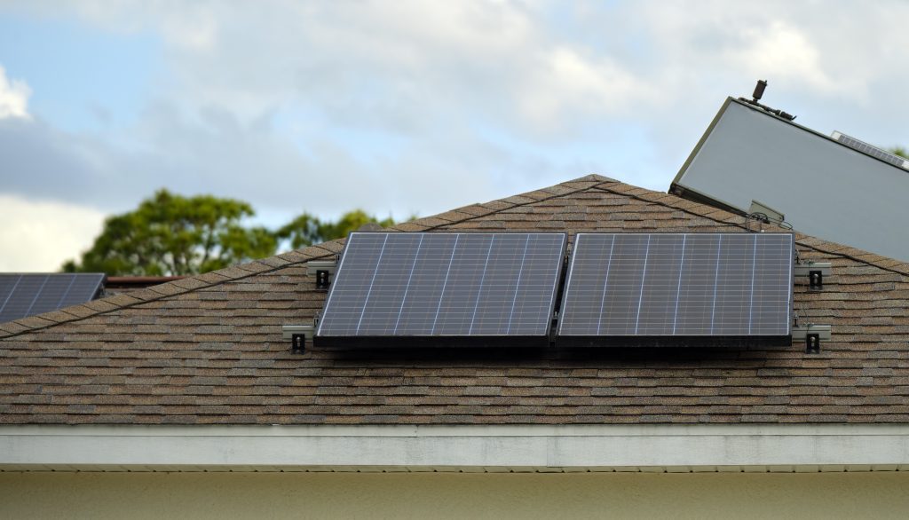 Residential house with rooftop covered with solar photovoltaic panels